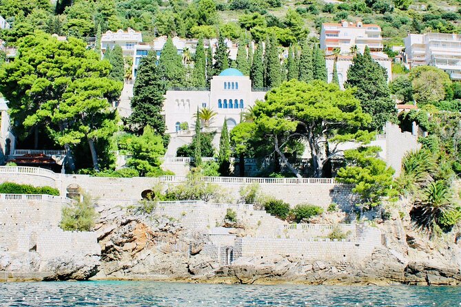50-minute Panoramic Cruise of Dubrovnik with English Audio Guide - St. Jacob’s Beach: a dramatic backdrop while you cruise