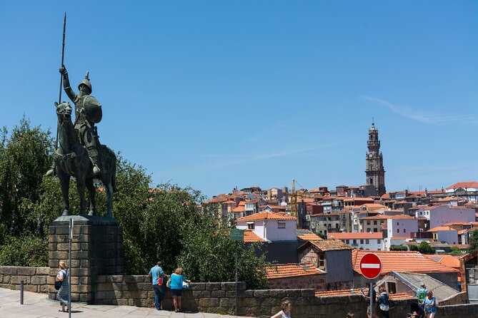 Amazing Secrets of Porto: Self-Guided Puzzle Adventure - Episcopal Palace and Igreja dos Grilos: big signals from the sidewalk