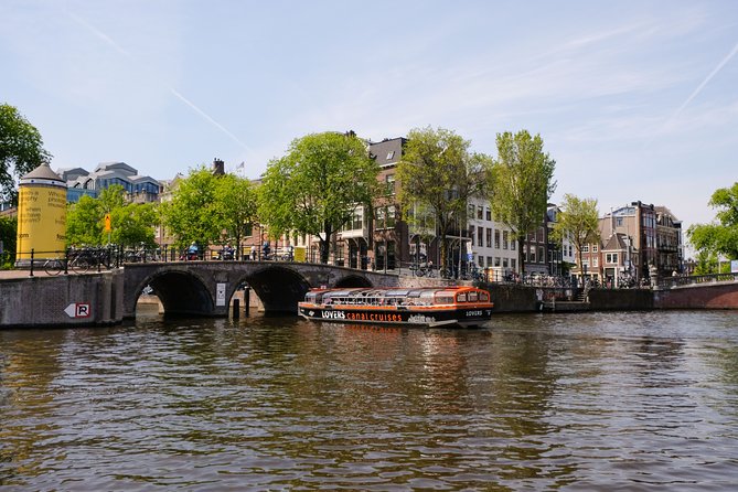 Amsterdam 1h Canal Cruise by Semi-Open Boat with Audio Guide - The 1-Hour Route: Skinny Bridge, Anne Frank House, and the Canal Belt