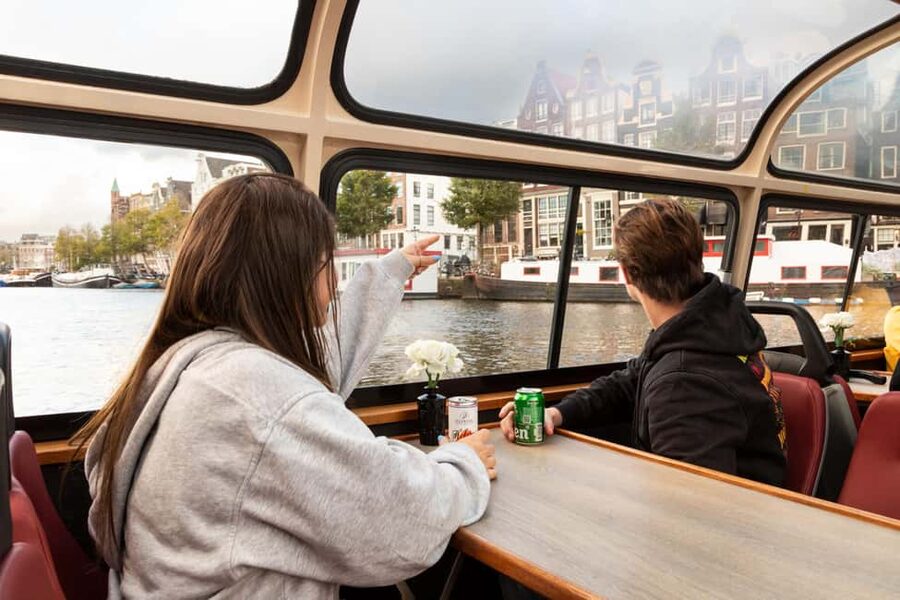 Amsterdam: Canal Cruise with Live Commentary & Audio Guide - The boat: covered comfort with an outdoor photo spot