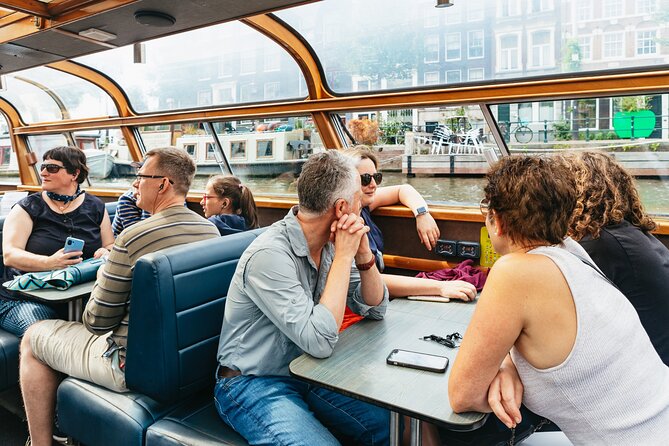 Amsterdam City Centre Cruise on heated boat with Audioguide - Getting on board near Centraal, the Rijksmuseum, or Damrak