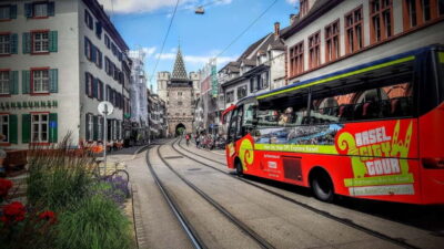 Basel: Sightseeing Bus Tour with Audio Guide - First part of the loop: market squares, churches, and learning institutions