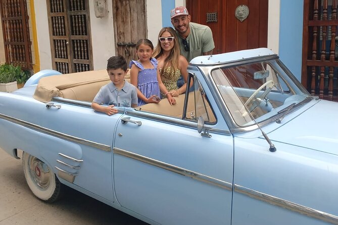 Cartagena Luxury Classic Car Tour + Bilingual Historian Guide - Torre del Reloj and Plaza de los Coches: Clock Tower Views and Sweet-Snack Energy