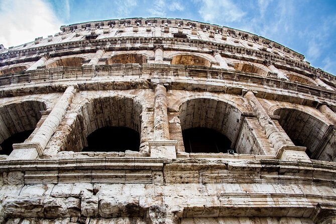 Colosseum with Digital Audioguide and Arena Option - Meeting at the Arch of Constantine: where your day starts