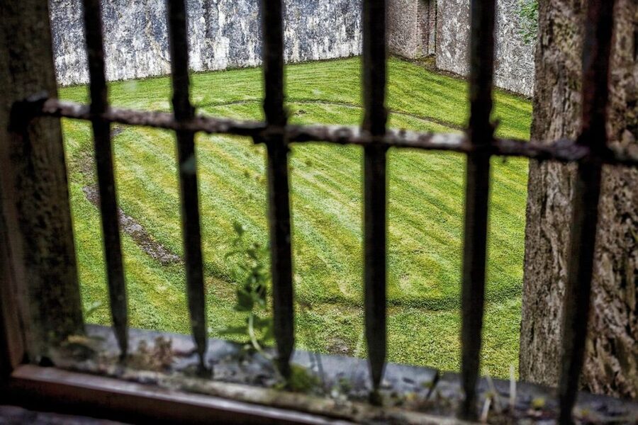 Cork: City Gaol Tour with Audio Guide - Inside the cells: lifelike figures, furnishings, and haunting sound effects