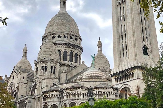 Montmartre Self-Guided Audio Tour: More Than Meets the Eye - Moulin de la Galette windmill and the art behind the facade