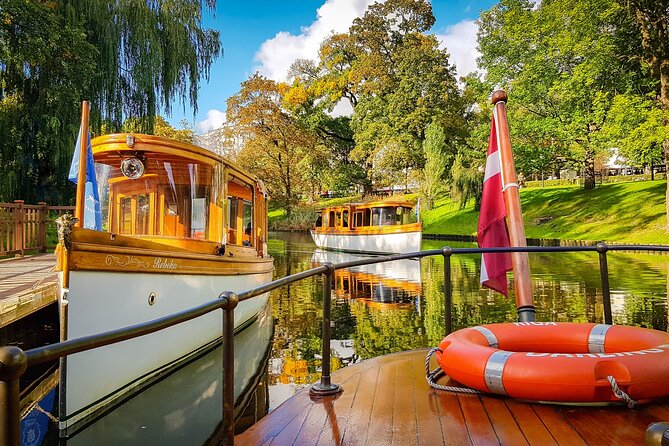 Riga City Canal & Daugava River Premium Boat Tour with Audioguide - Boarding at Bastejkalna Park: quiet electric boat feel