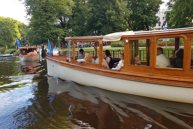 Riga City Canal & Daugava River Premium Boat Tour with Audioguide - Big Christopher, Riga Castle, and river heritage symbolism