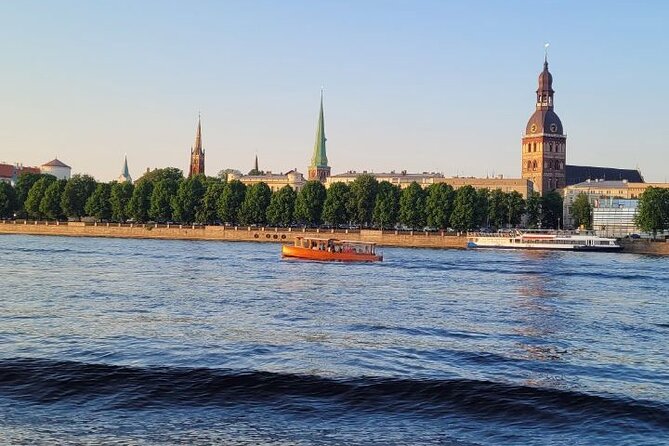 Riga: Evening or Sunset Boat Tour with Drink and Audio Guide - The welcome drink: small perk, real morale boost