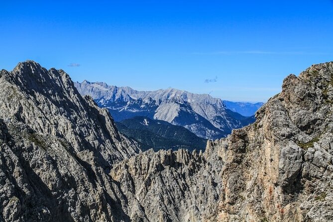 Self-Guided 1,5-hour Tour of Innsbruck: Exciting Stories, Photo Spots & Desserts - Stop 4: Nordkettenbahnen stations by Zaha Hadid (and the cable car choice)